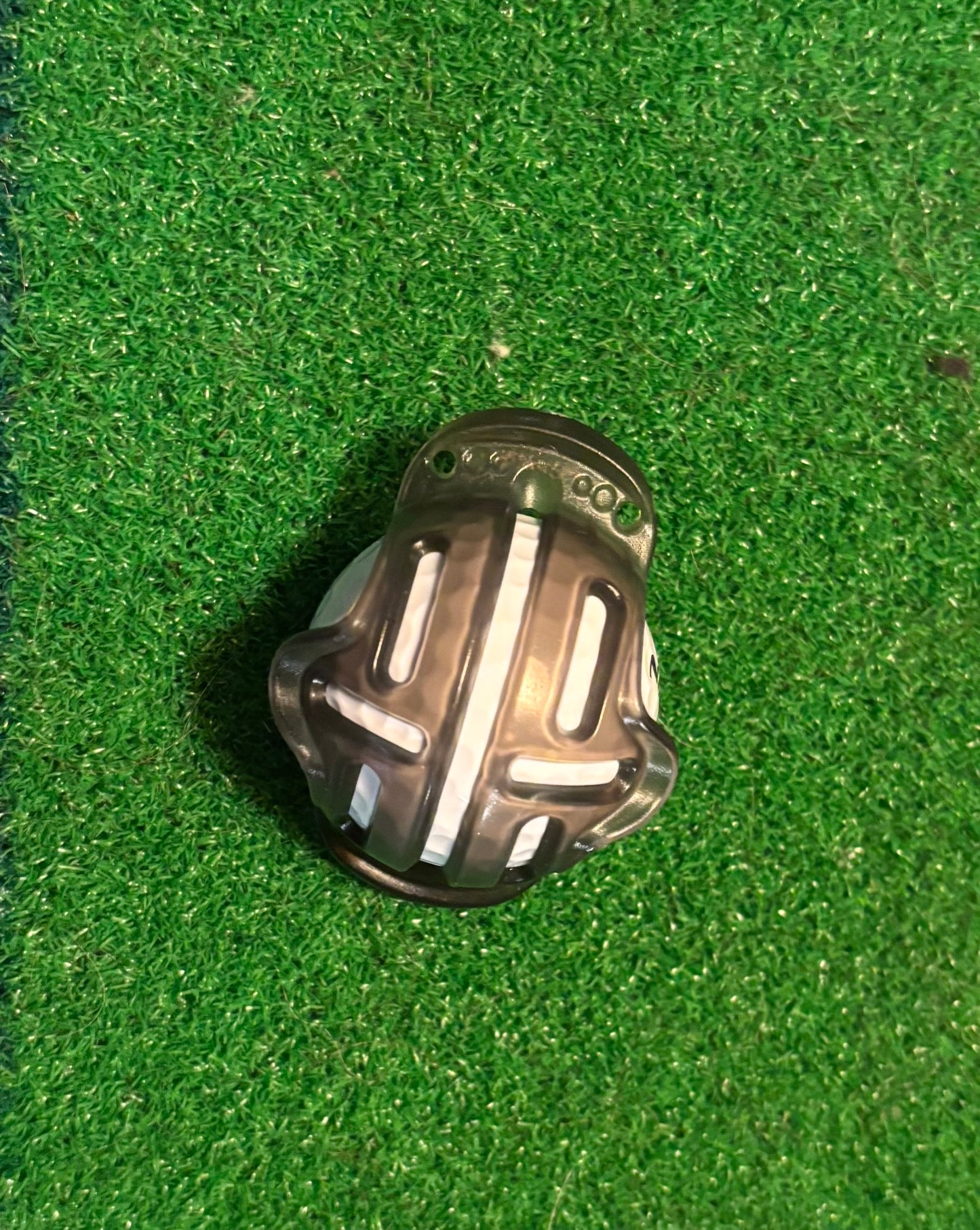 ball marker template on a golf ball with a green grass background