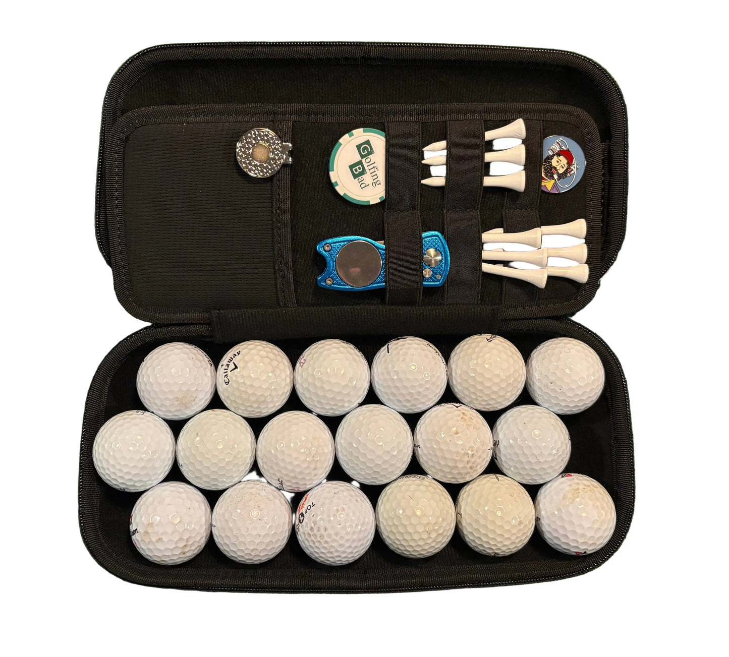 black accessories case open showing large golf ball compartment full of golf balls with an organise panel with pitch mark repair tool golf ball markers golf ball marker hat clip and a pitch mark repair tool on a white background