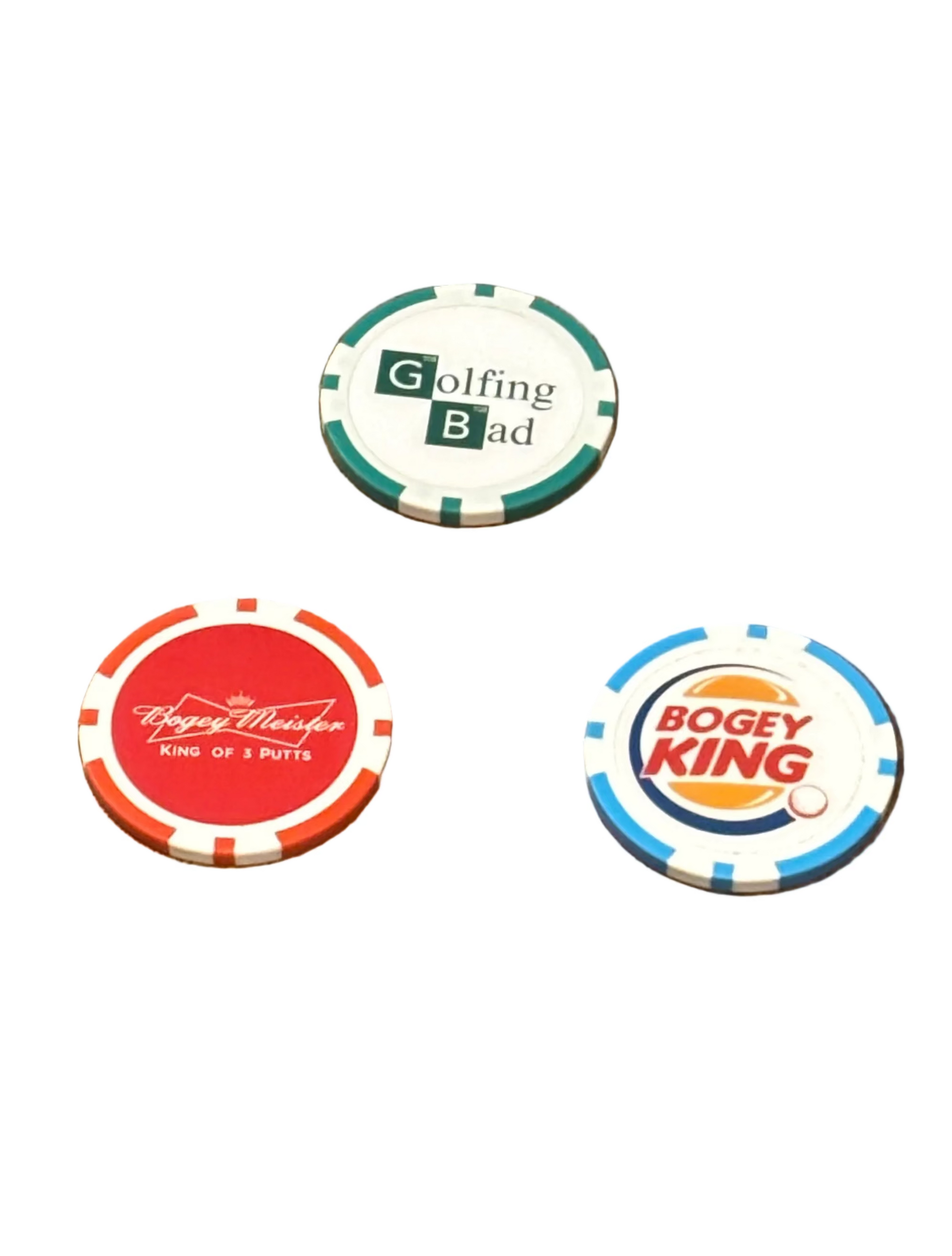 Three poker chip golf ball markers golfing bad bogey meister and bogey king with different designs and text on a white background