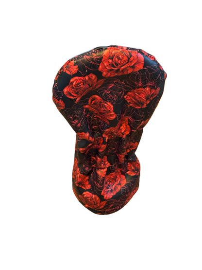 Golf club head cover with red floral pattern on a white background