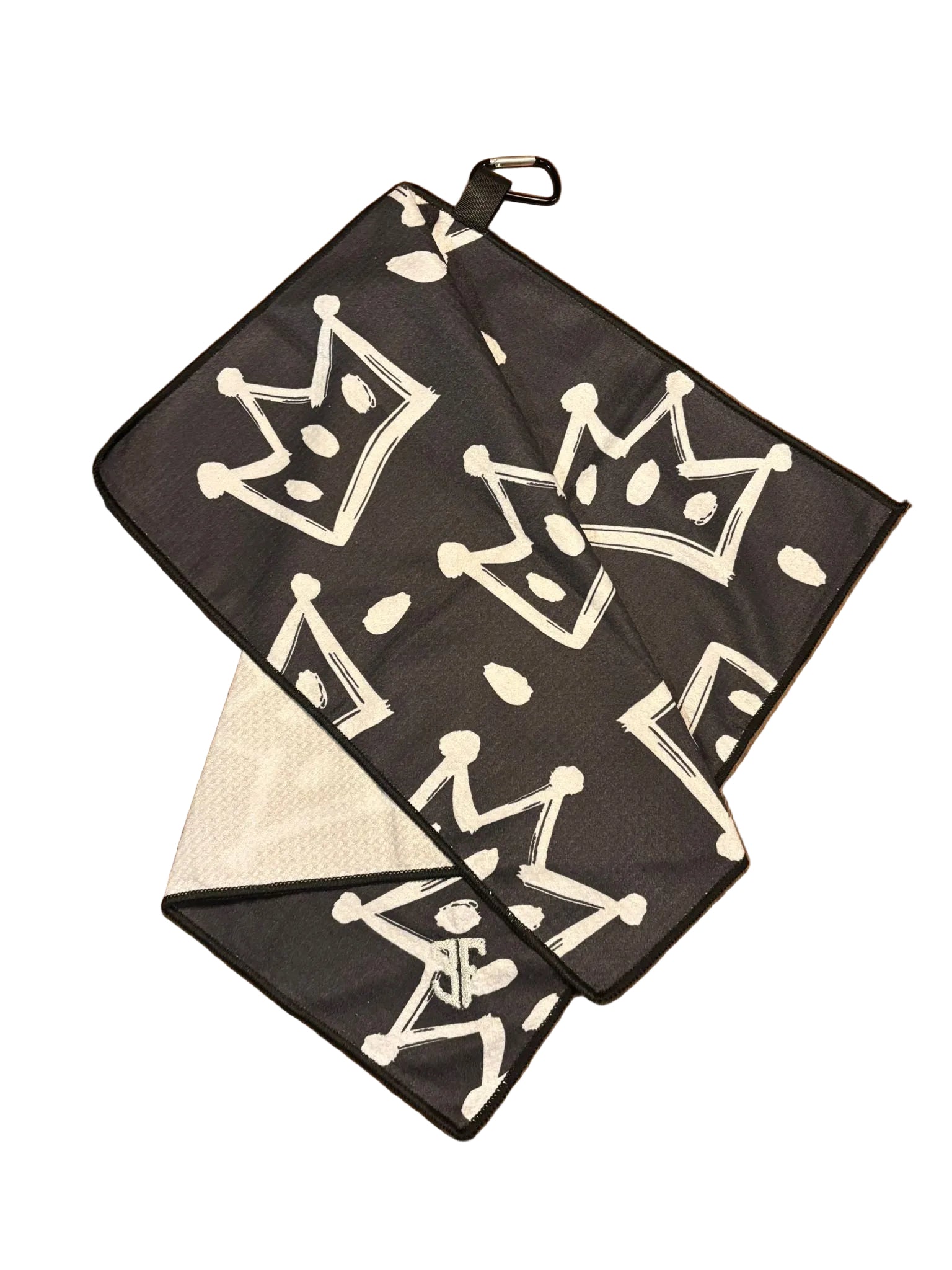 black waffle golf towel with white crown detailing with carabiner with white background