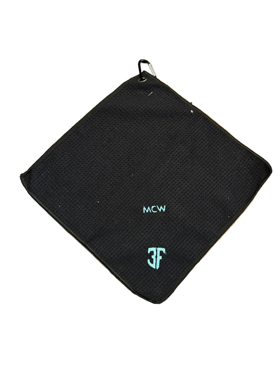 black waffle gold towel with light green lettering on a white background