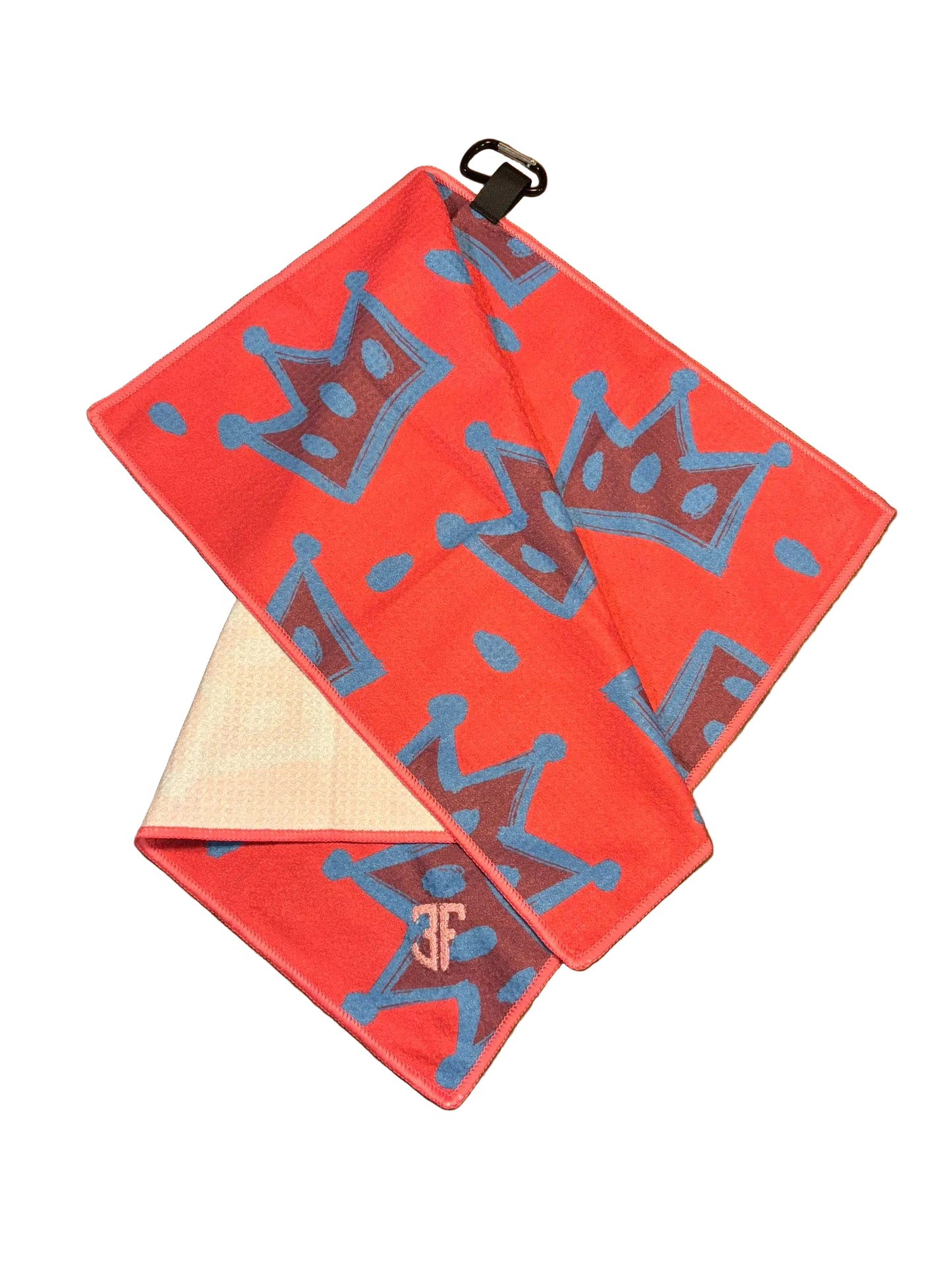 pink waffle golf towel with blue crown detailing with carabiner with white background
